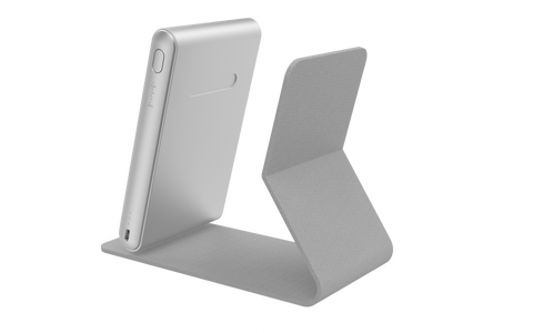 User demonstrating BioLight Shine device for light therapy treatment, emphasizing its ergonomic handheld design.