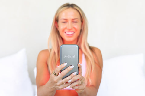 Glow device carefully placed in a pocket, showing its portability by BioLight.