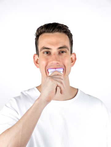 Guardian+ Oral Device by BioLight shown with Teeth Whitening Gel Pens, featuring three light settings for customizable treatment.