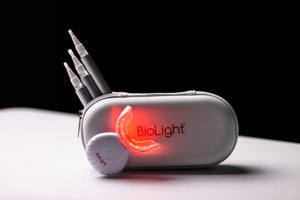 BioLight's Guardian+ Oral Device showing off its flexible mouthpiece and blue/red light settings for a personalized whitening experience.